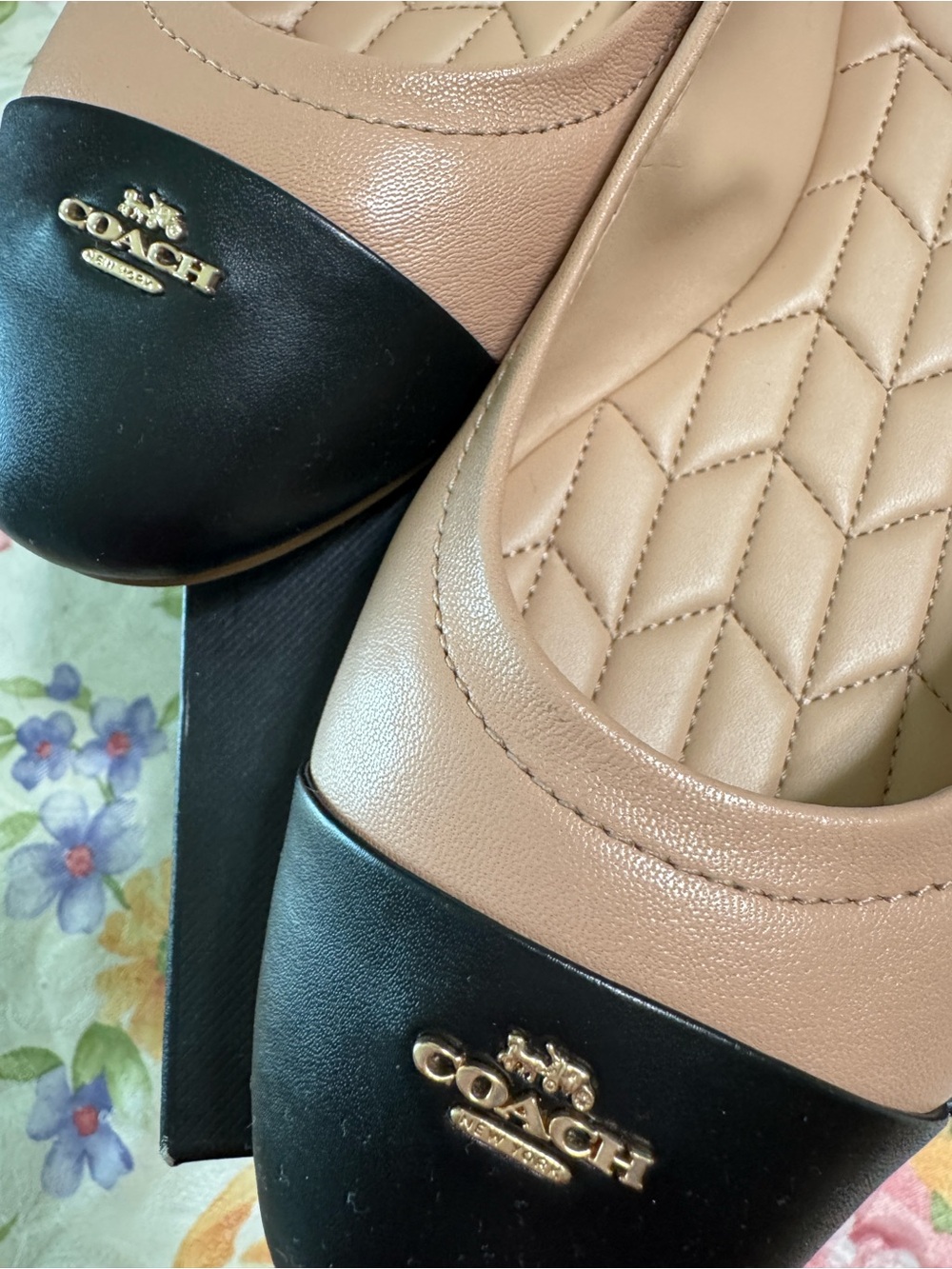 Coach Beige and Black Quilted Leather Ballet Flats with Gold Logo.